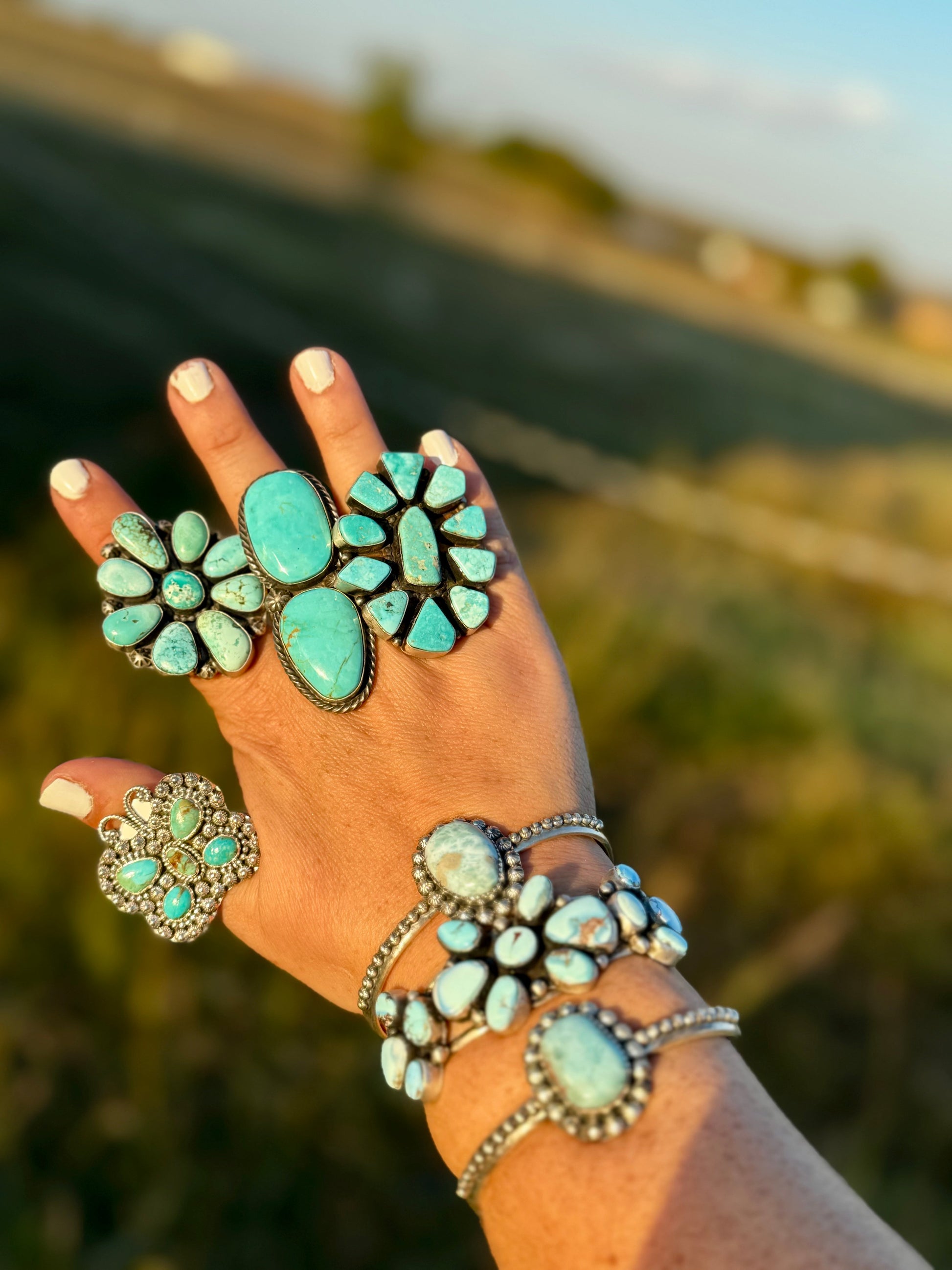 Turquoise jewelry on hand, style 032A2D89-E9A9-4F68-82CF-4251CF1BB216.
