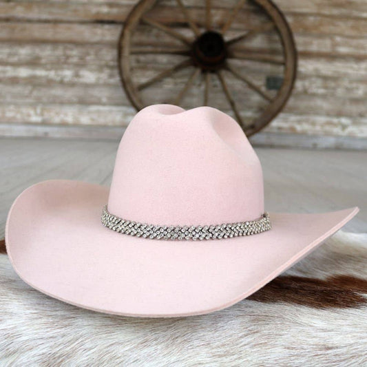 Pink cowboy hat with jeweled band.