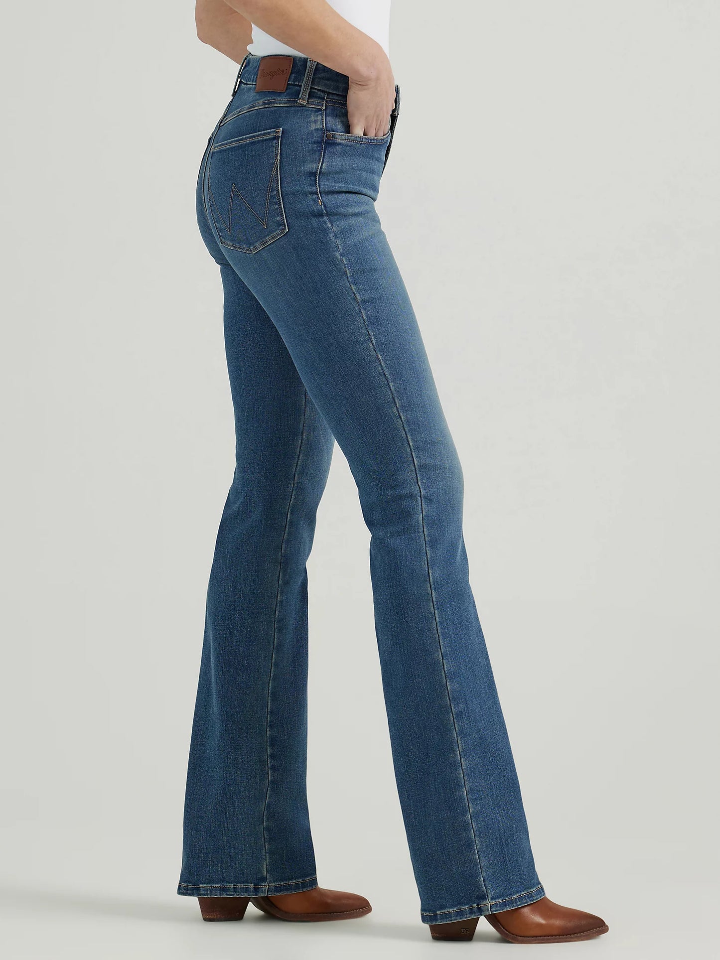 Woman wearing blue flared jeans.