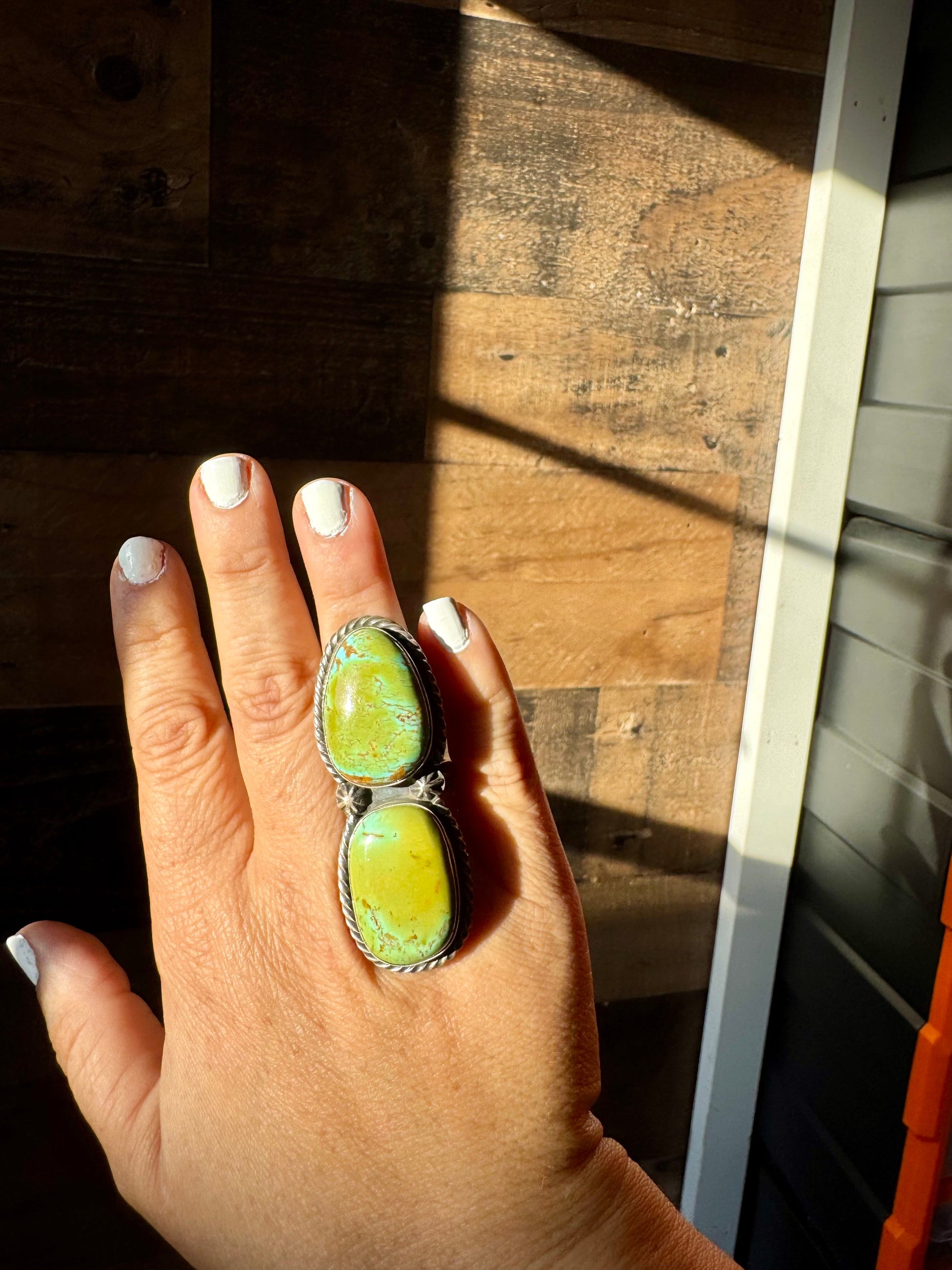 Turquoise ring on hand, (1DC51F3C-D707-4C76-A88F-BFE2F482A523)