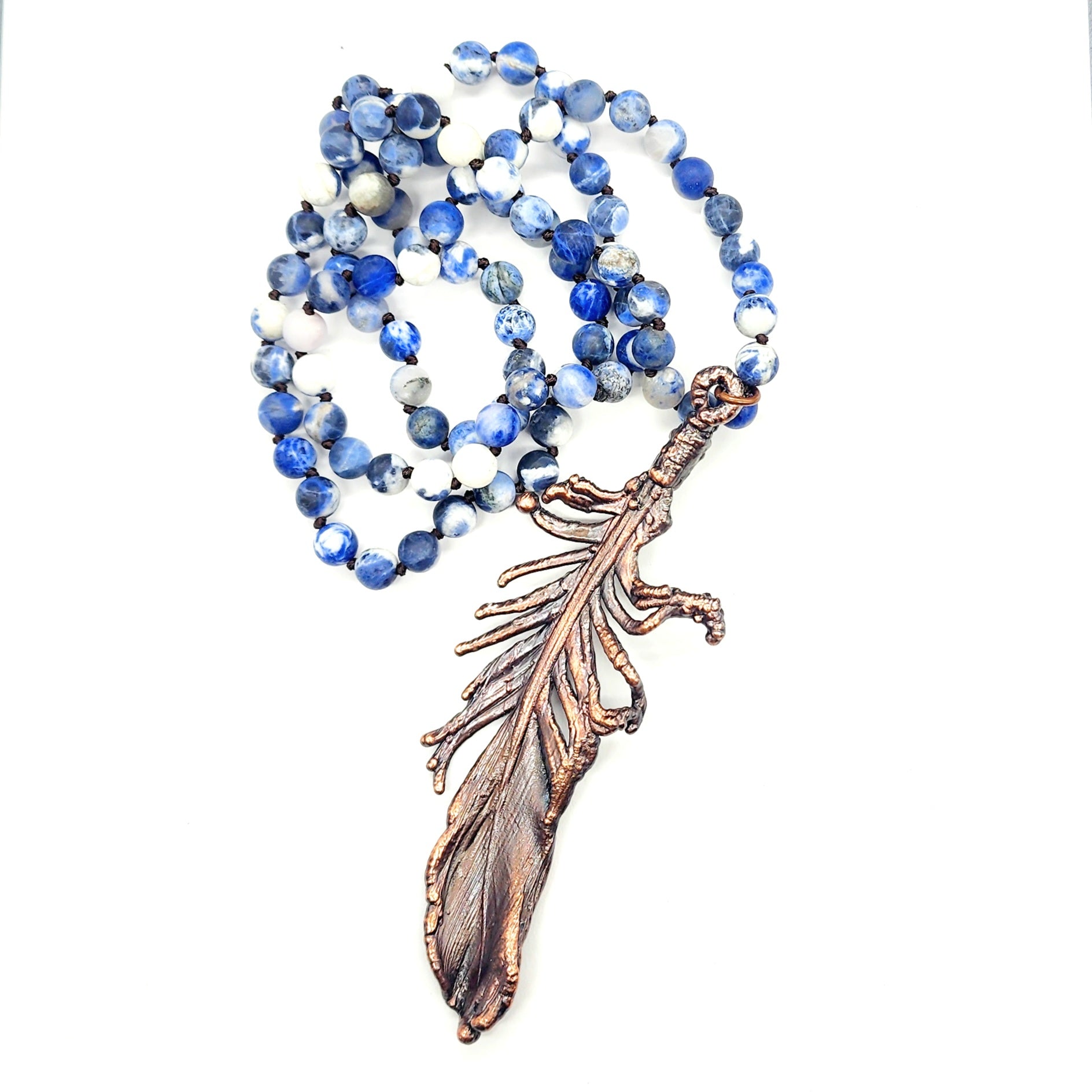 Necklace with blue beads and feather pendant.