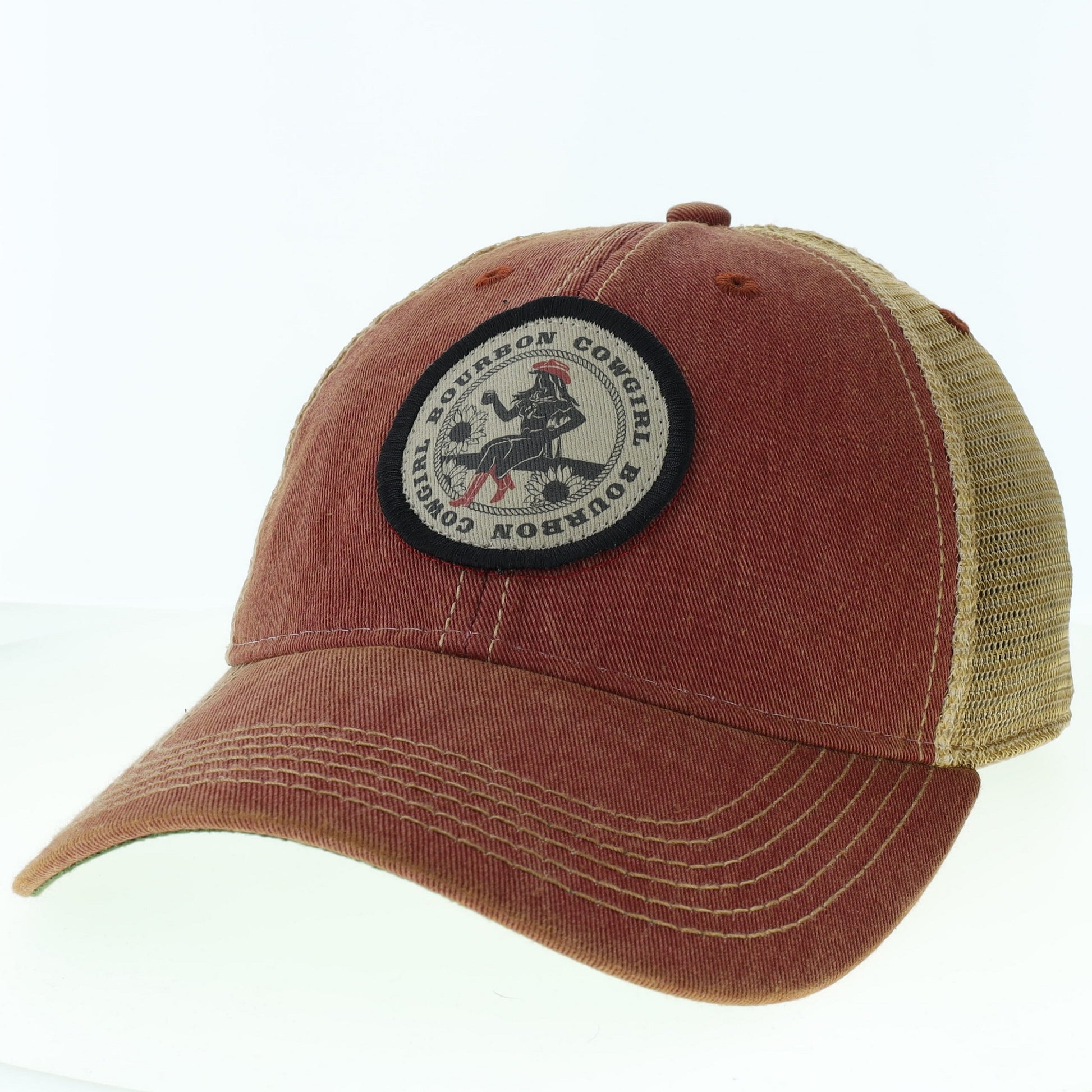 Red and tan baseball cap with a Bourbon Cowgirl patch.