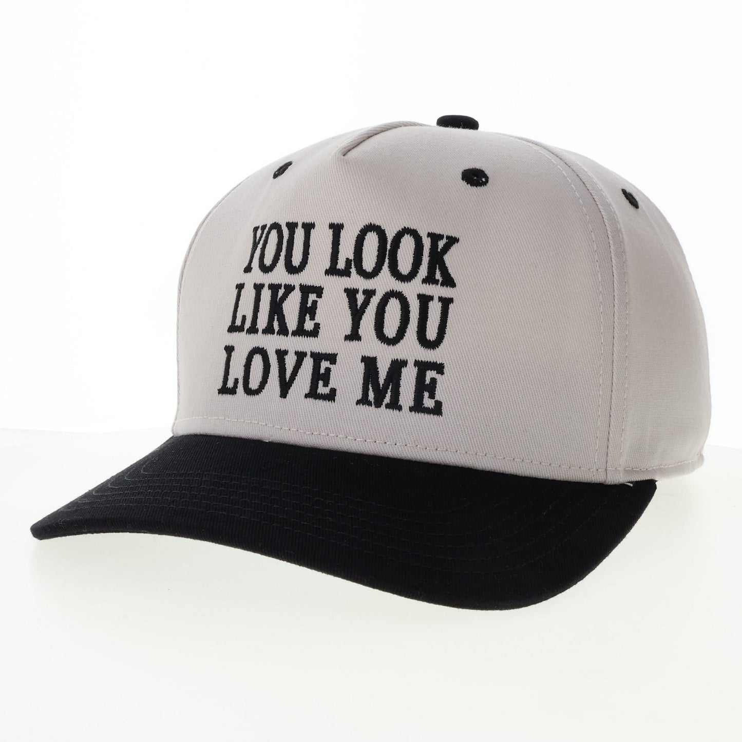 Baseball cap with You Look Like You Love Me text.