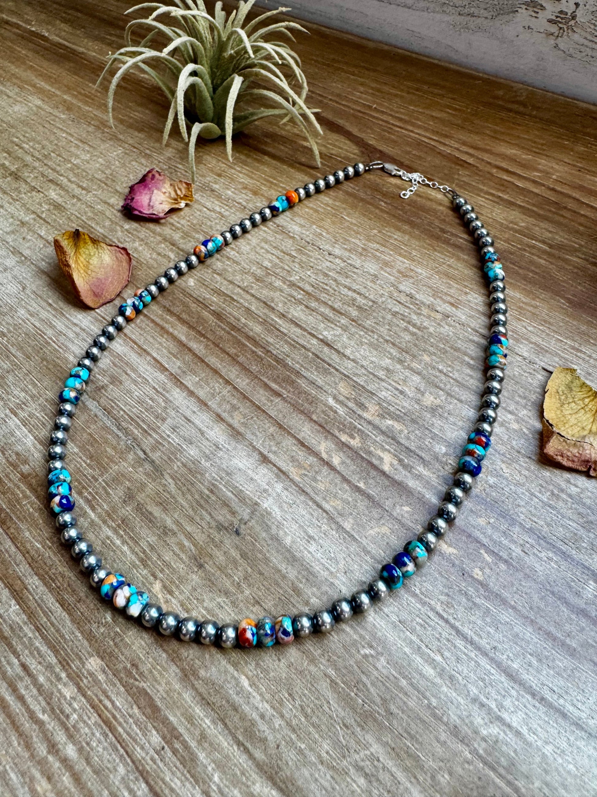 Turquoise beaded necklace on wood, 2C0FC7AB-6B1C