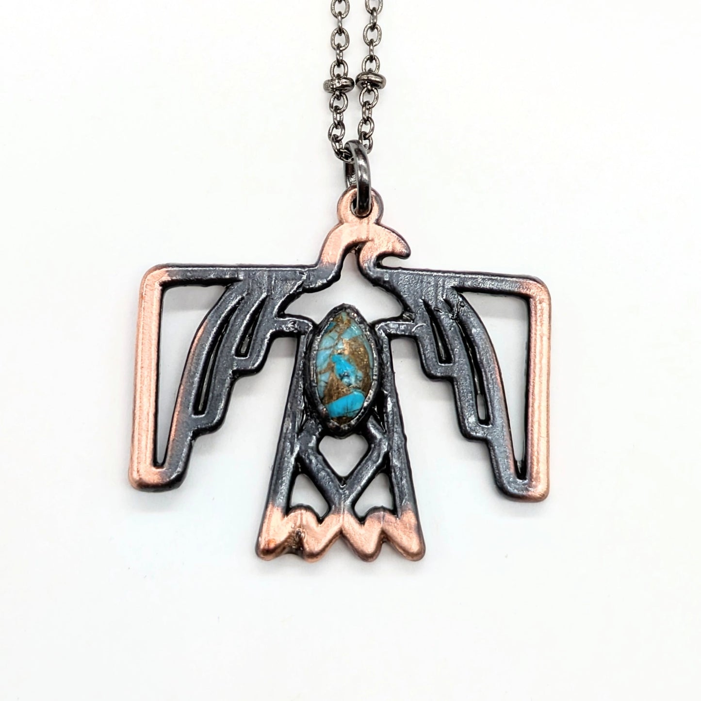 Thunderbird pendant necklace with turquoise stone