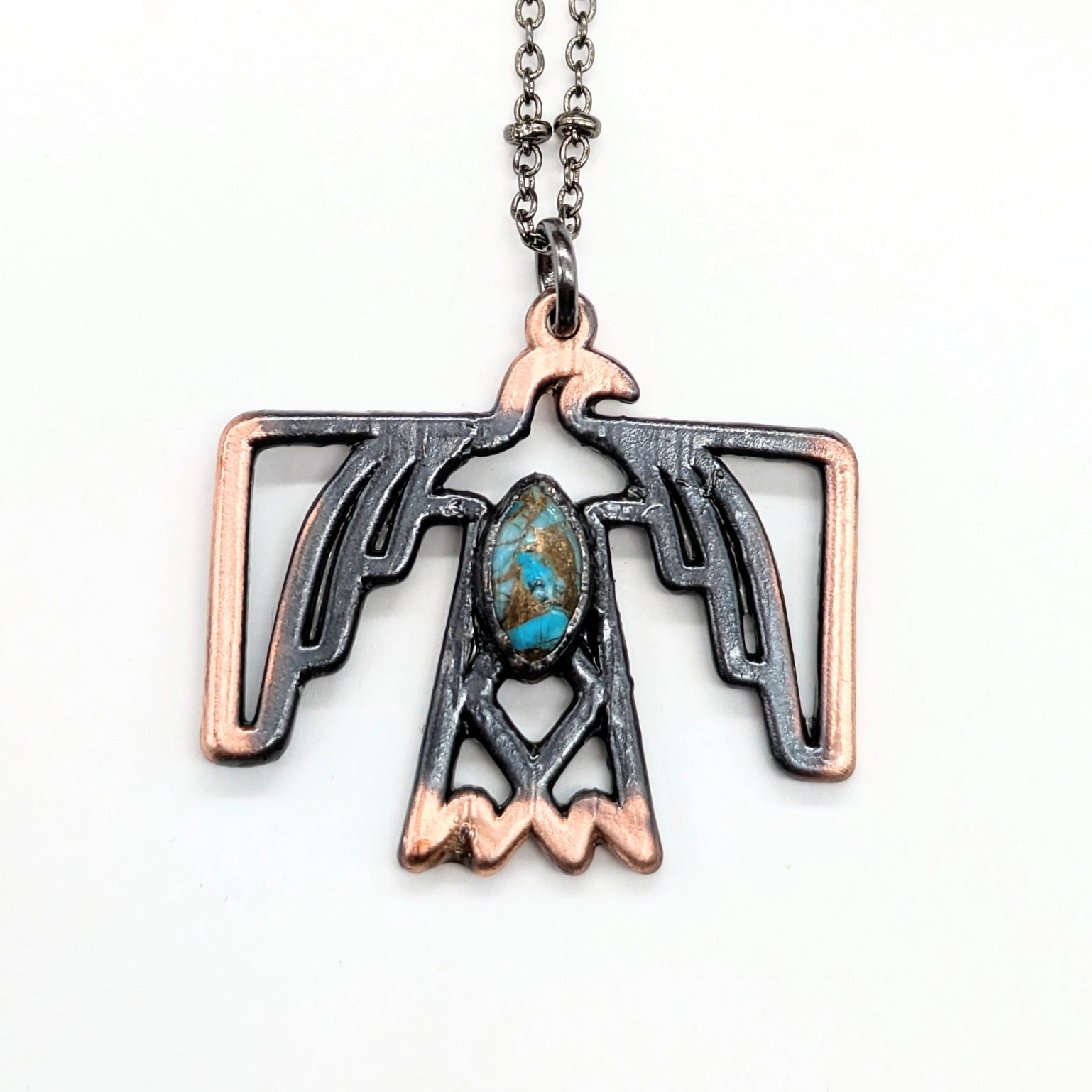 Thunderbird pendant necklace with turquoise stone