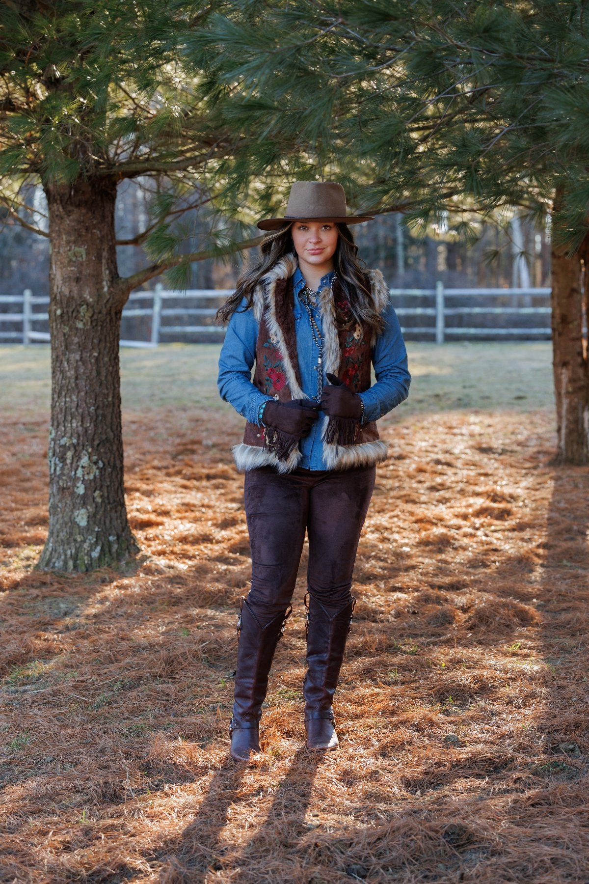 Woman in 381603 Chateau Vest and hat outdoors