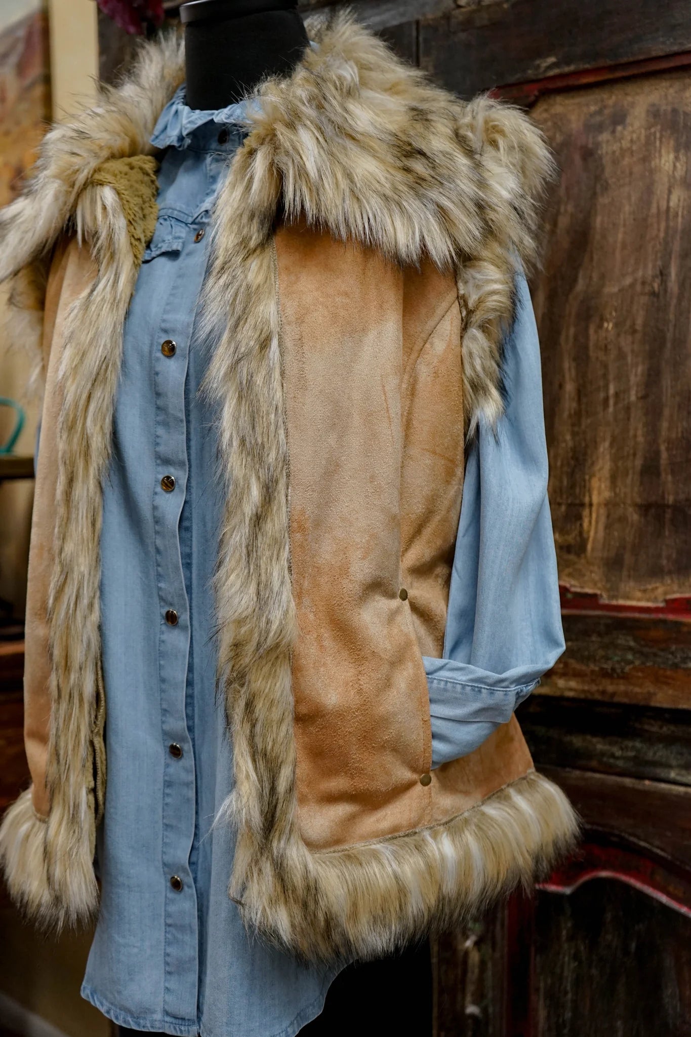 Faux fur vest over denim shirt, product photo