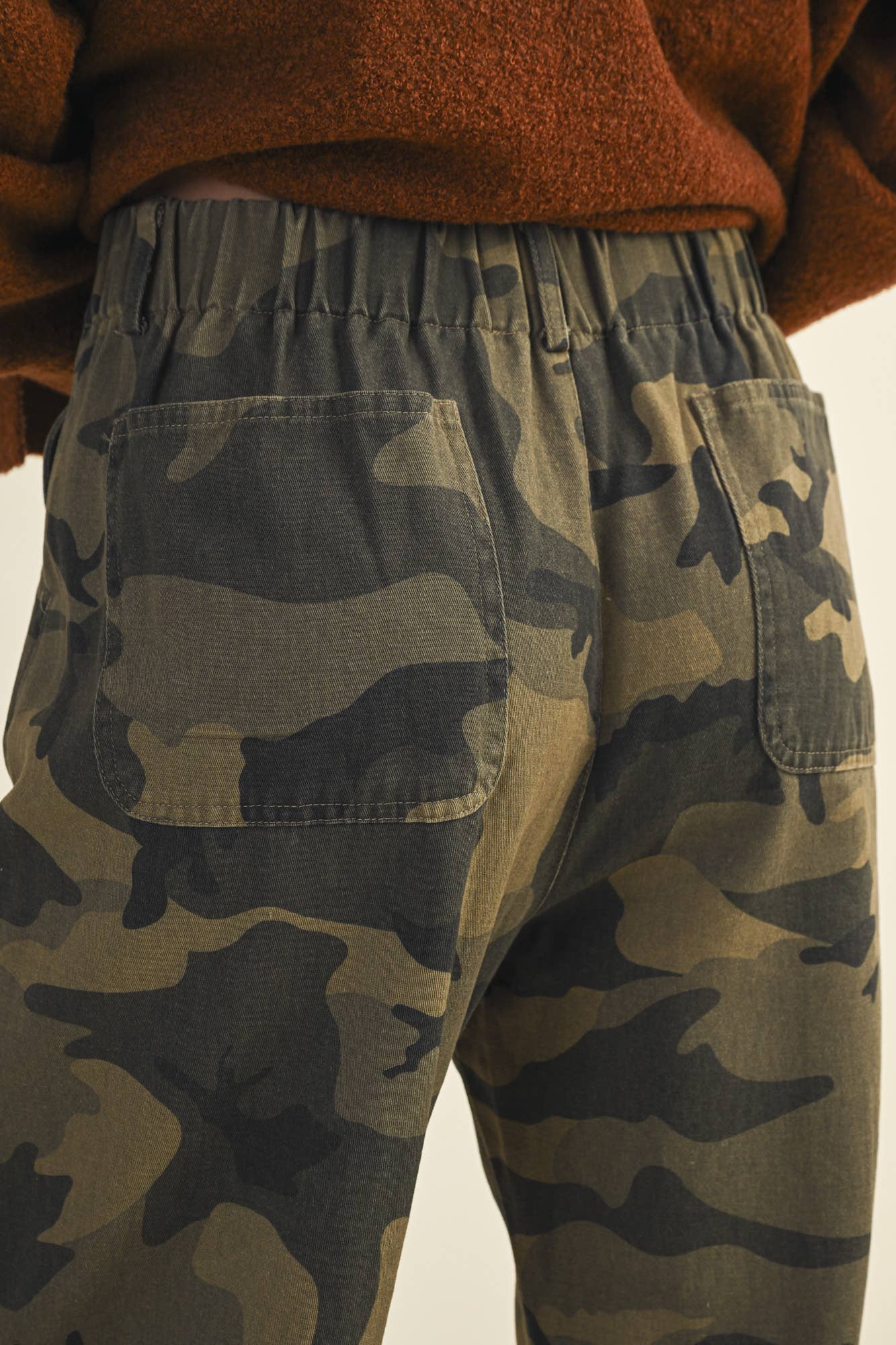 Camouflage pants with back pockets.