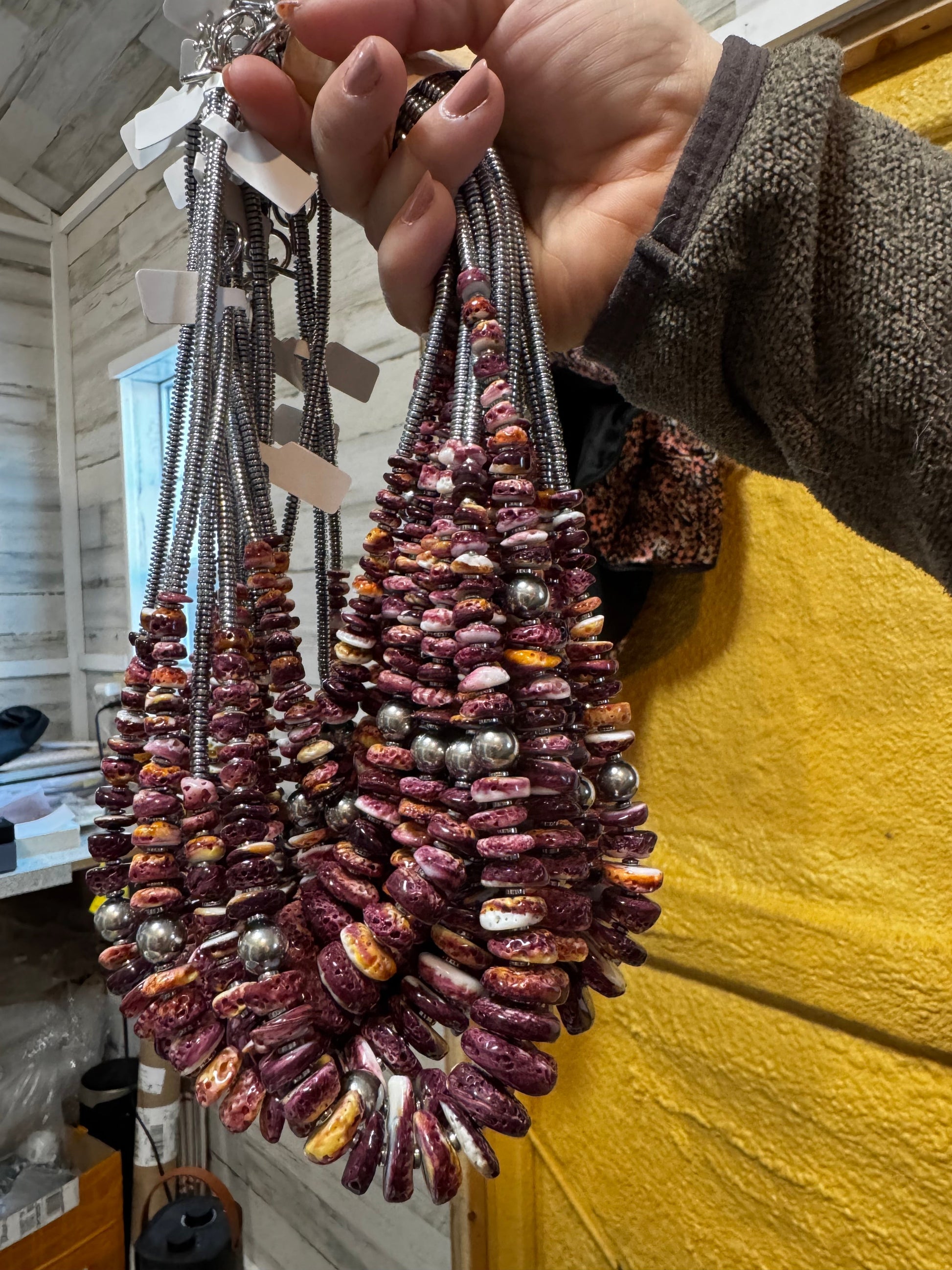 Hand holding necklaces - 4859F9E2 beaded design