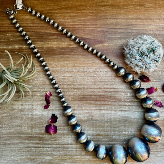 Sterling silver bead necklace with cactus and petals.