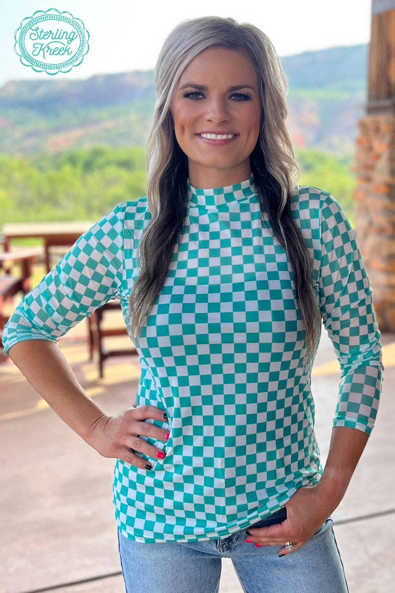Woman wearing a teal and white checkered shirt.