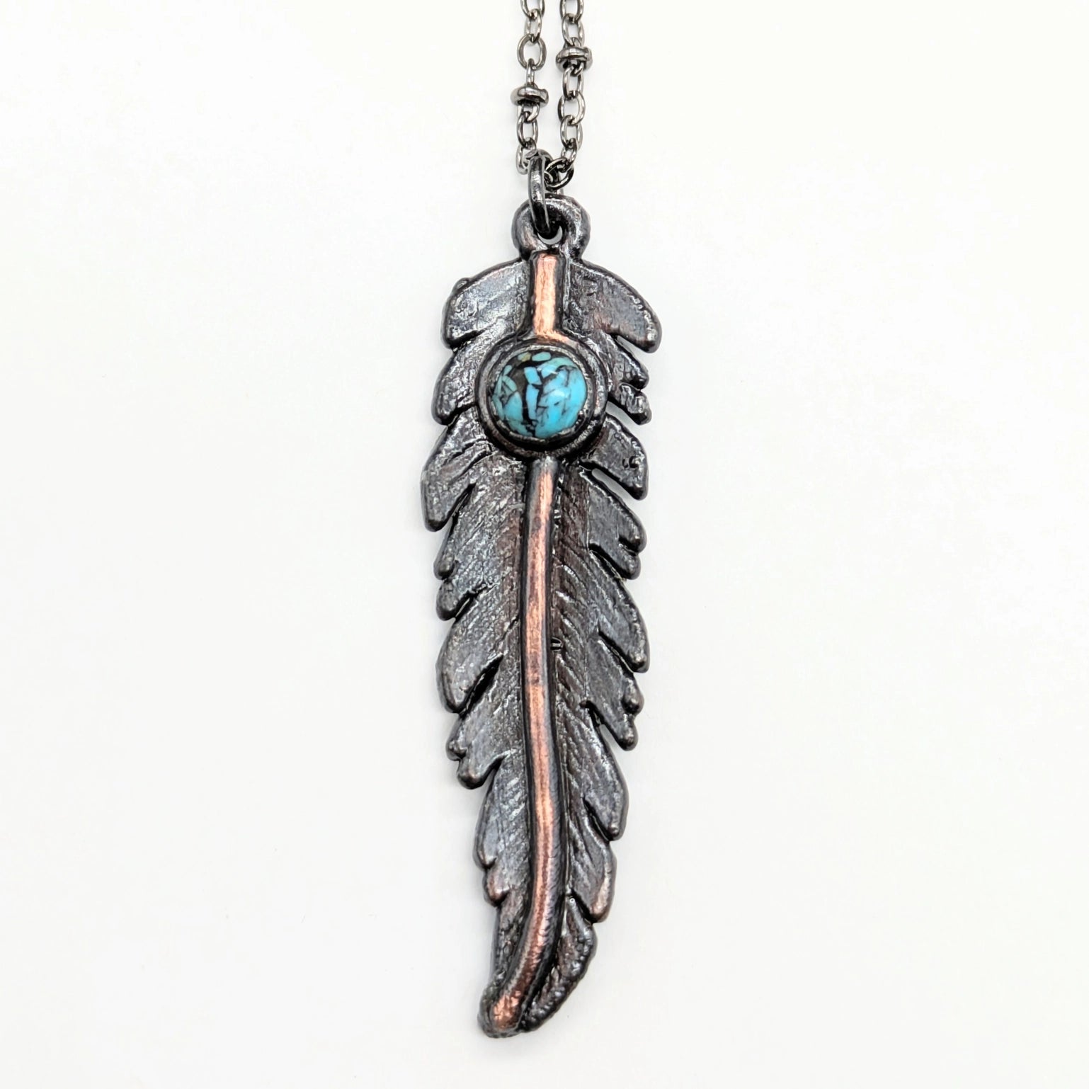 Feather pendant necklace with turquoise stone