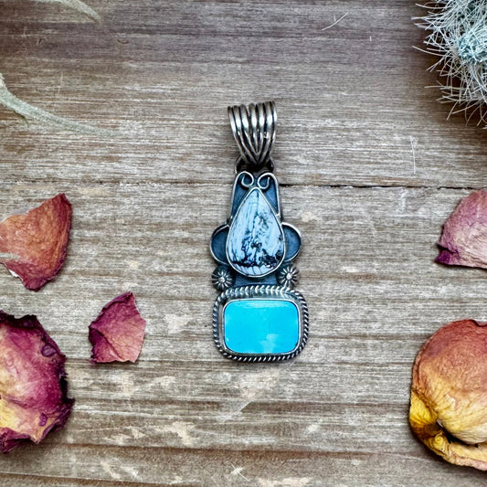 Silver pendant with turquoise and white stone.
