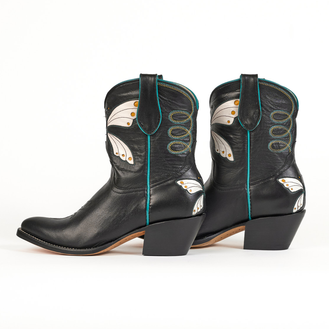 Black cowboy boots with butterfly wing design