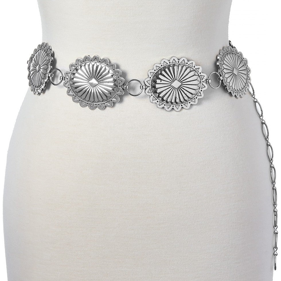 Silver western style belt on mannequin.