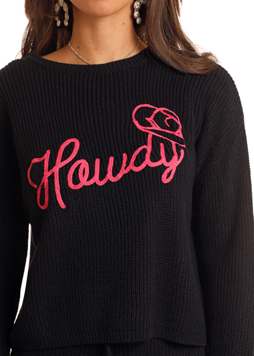 Black sweater with pink Howdy graphic.