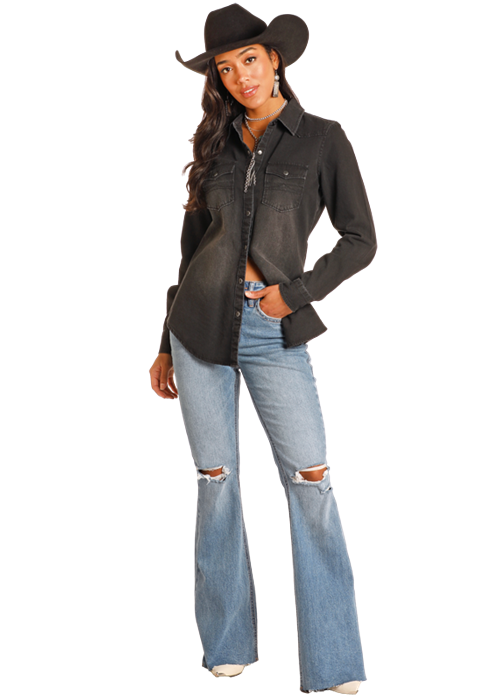 Cowgirl in black shirt and jeans
