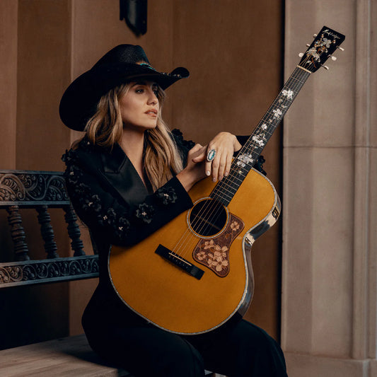 Country singer in black with guitar
