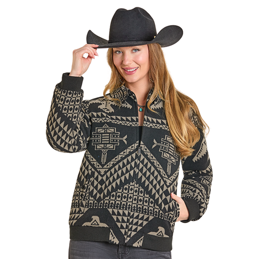 Cowgirl in patterned jacket and cowboy hat