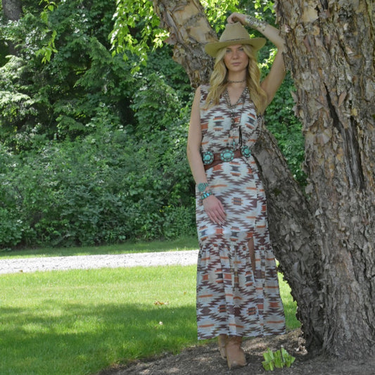 Woman in patterned maxi dress and hat