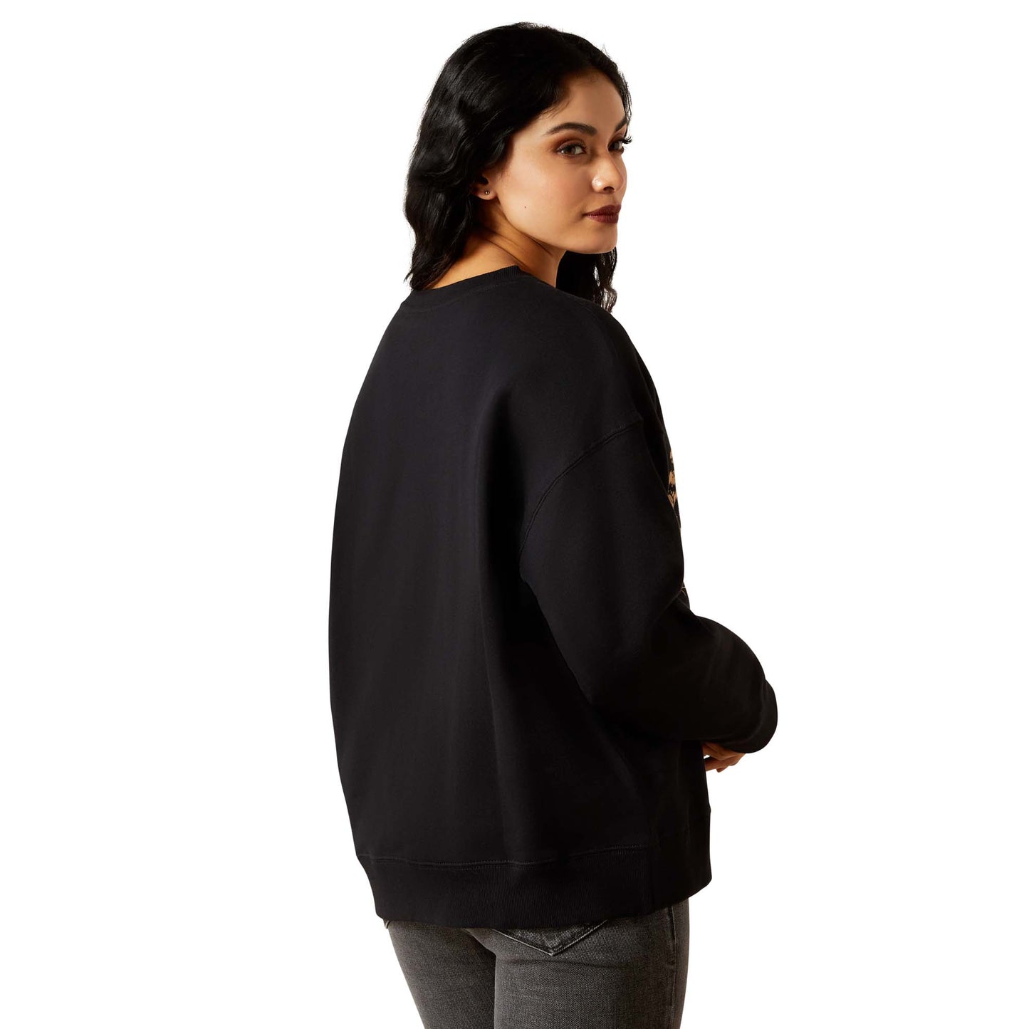 Woman wearing black sweatshirt, back view.