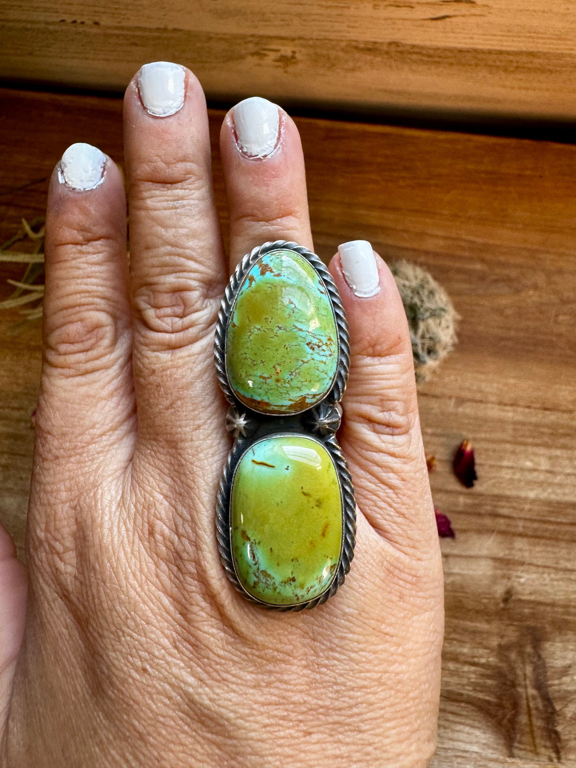 Turquoise ring on hand (FD0A9B2A-14FF)