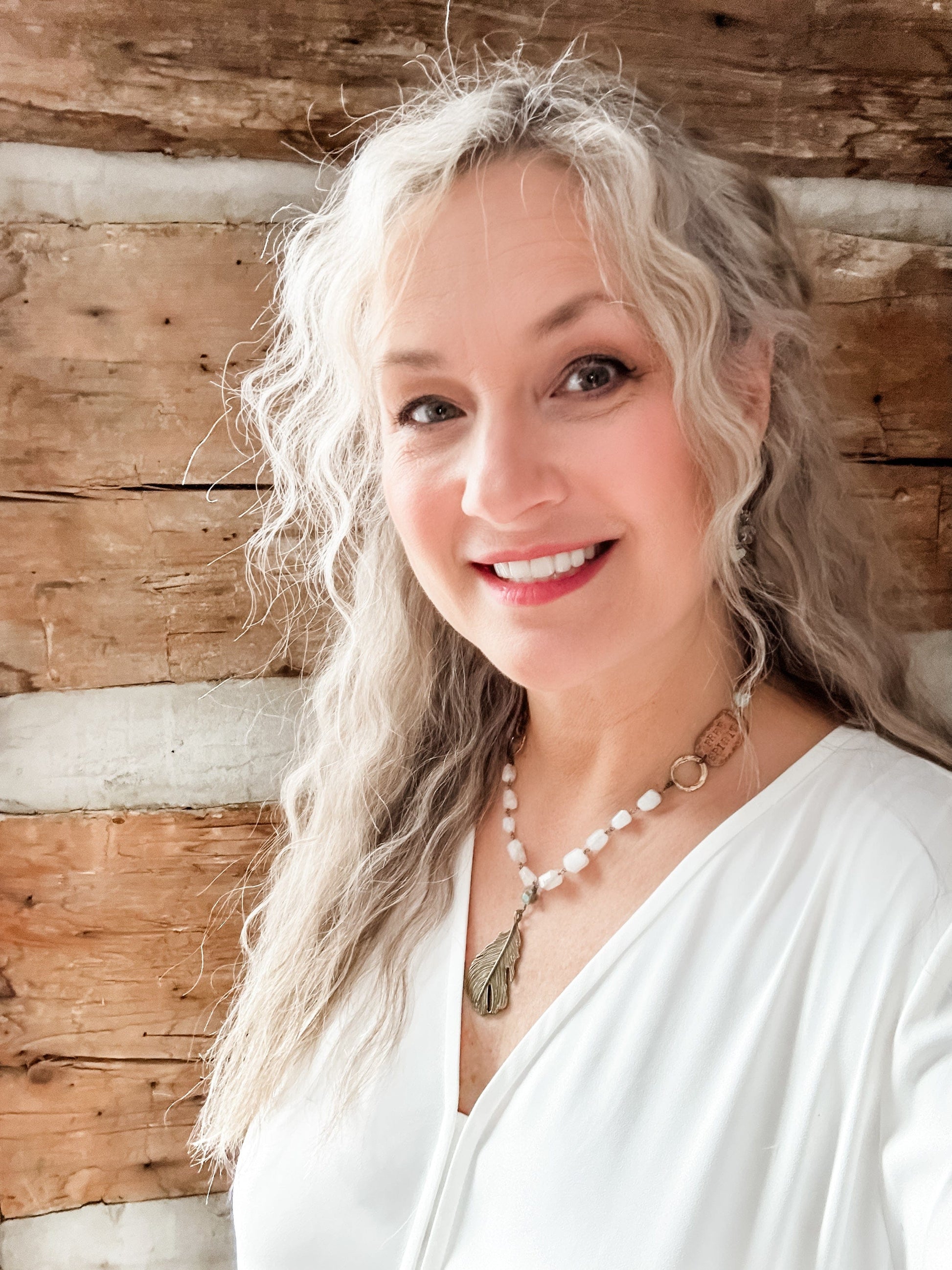 Woman with long gray hair, Facetune photo, 08-01-2024.