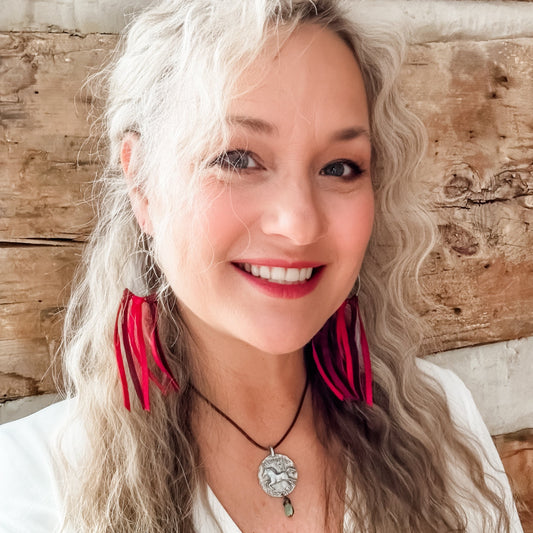 Woman with red earrings, Facetune, Jan 8, 2024