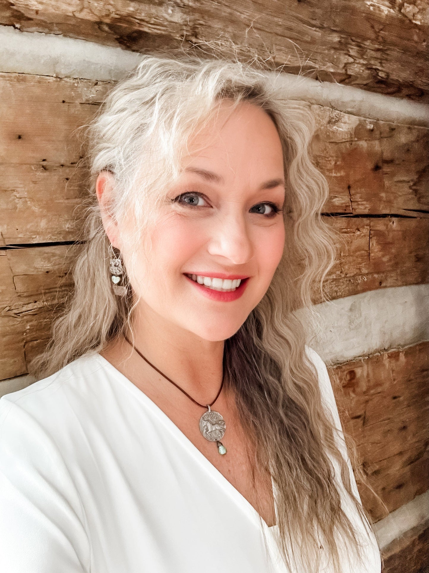 Smiling woman with blonde hair, Facetune edit 08-01-2024