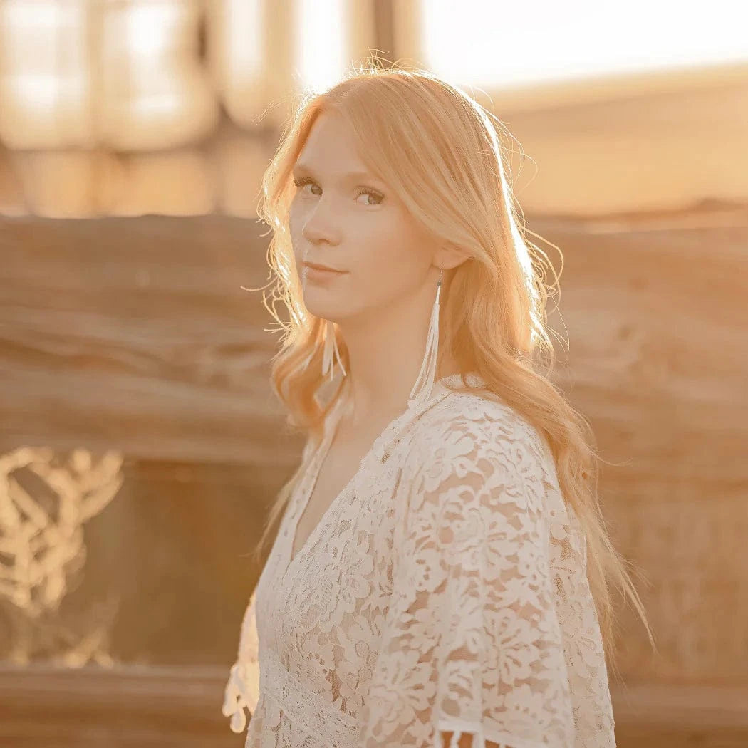 Young woman in white lace dress, portrait.