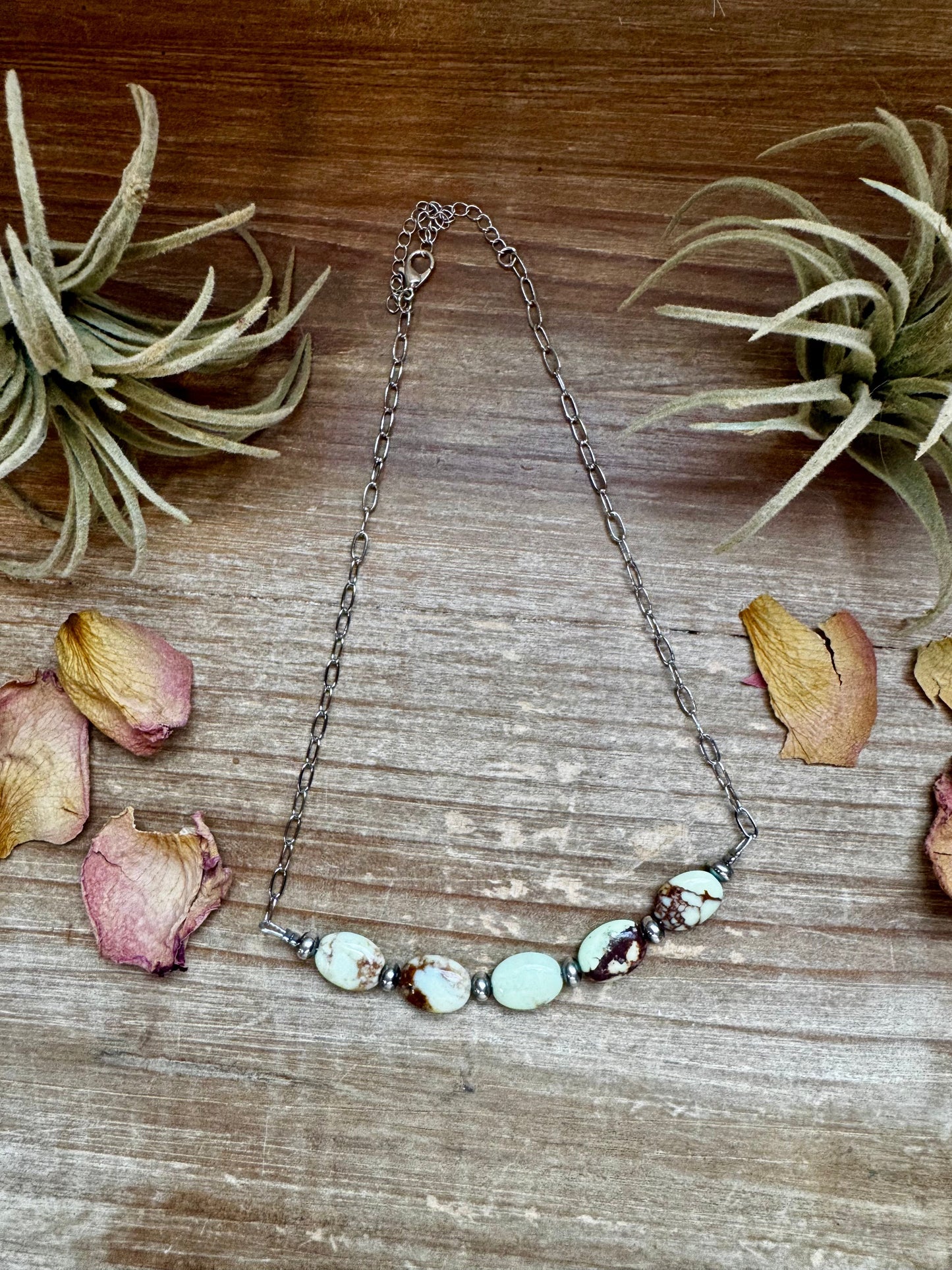 Necklace with light green stones and dried flowers