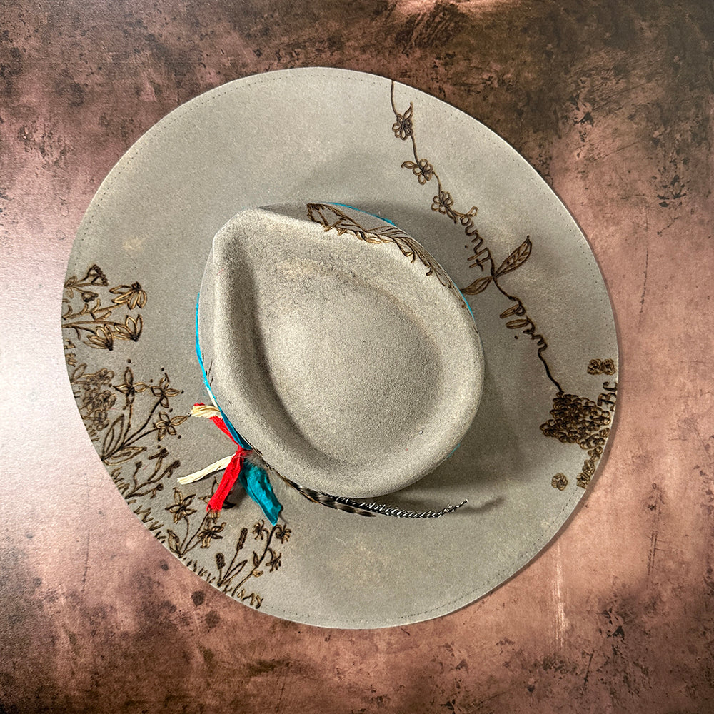 Gray hat with bronze floral design