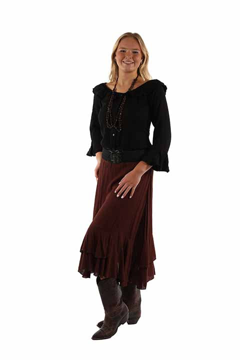 Woman in black top & burgundy skirt