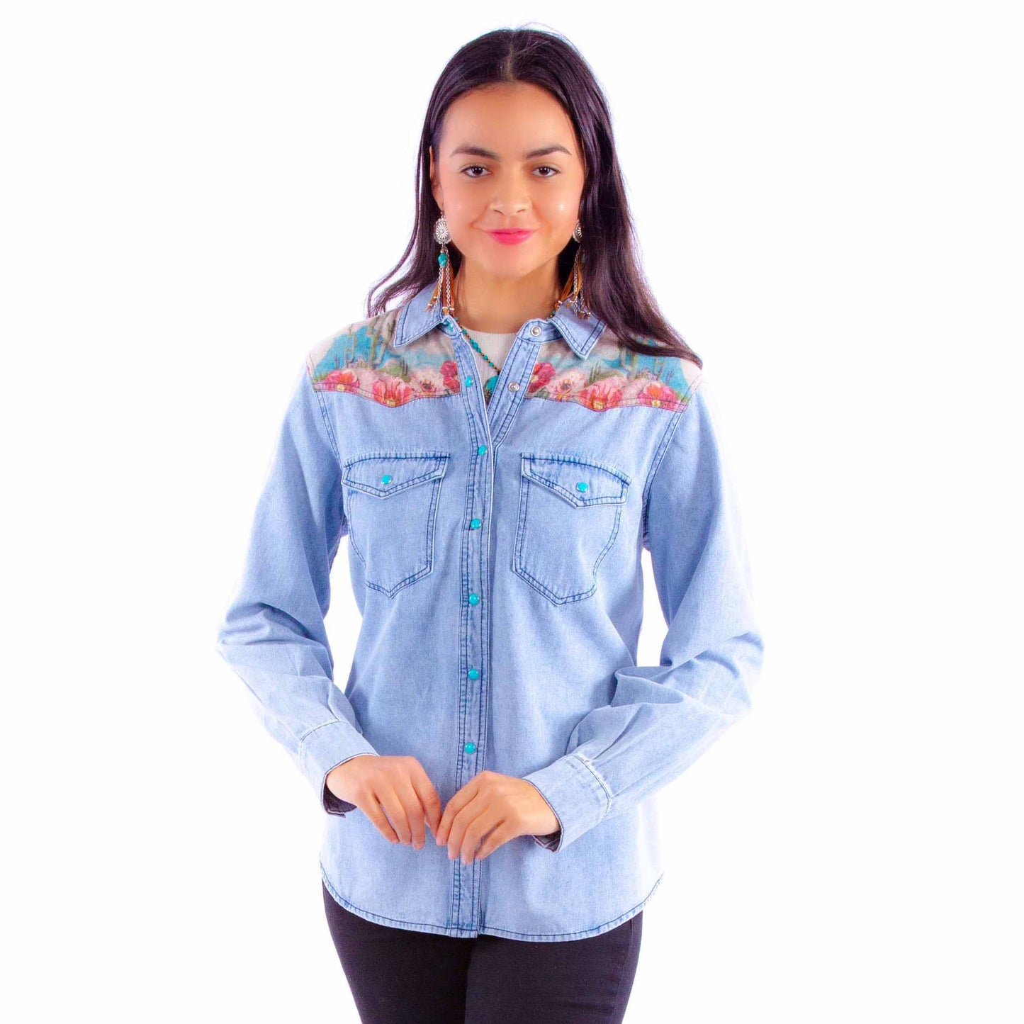 Woman in denim shirt with floral embroidery