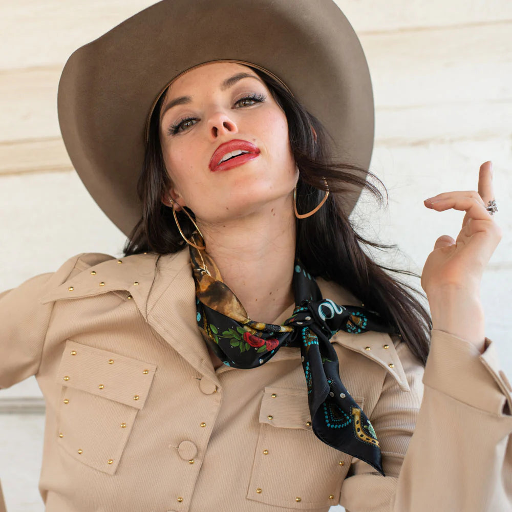Woman in cowboy hat & black fringe horse scarf