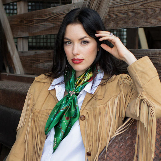 Woman wearing green fringe scarf and vintage western jacket