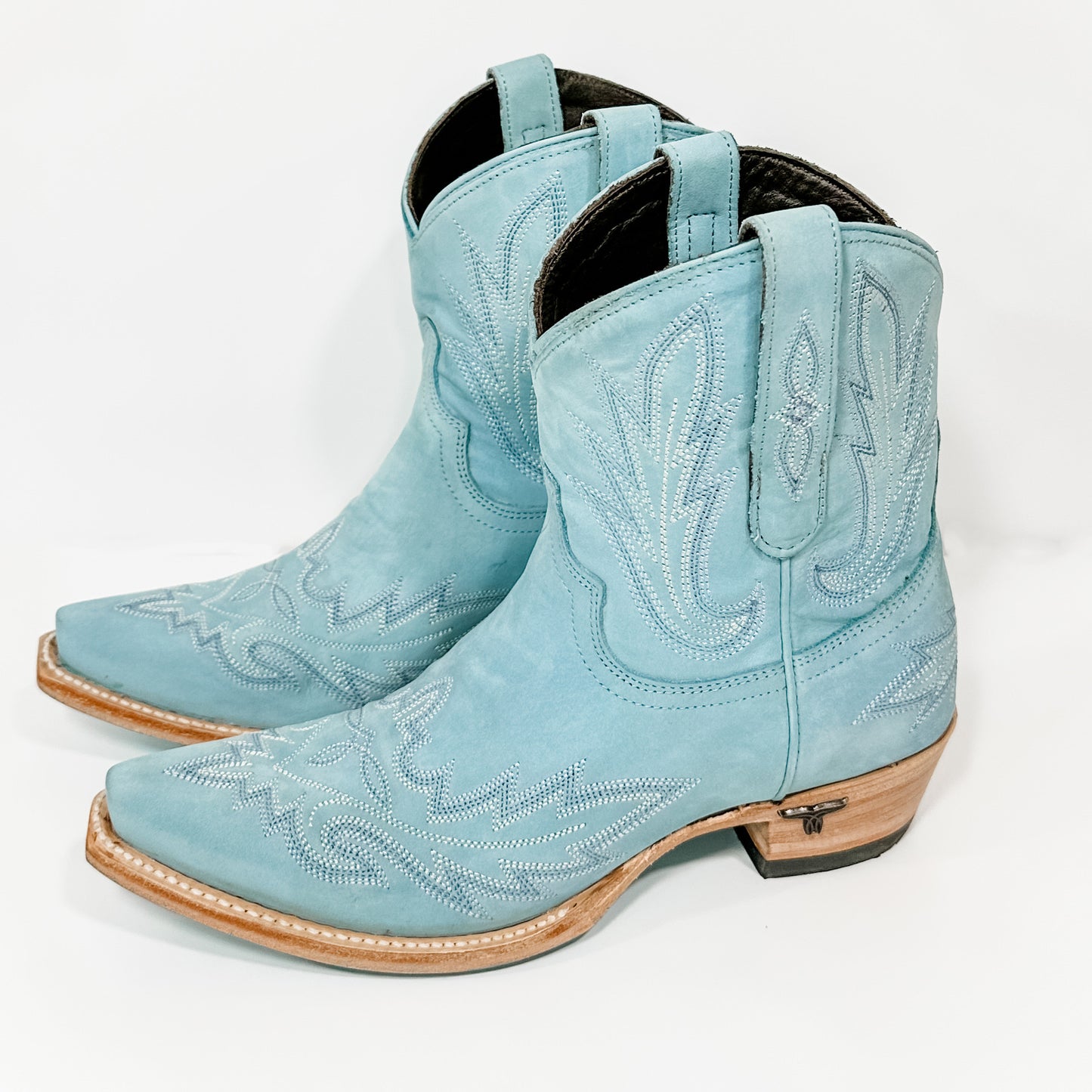 Pair of light blue cowboy boots.