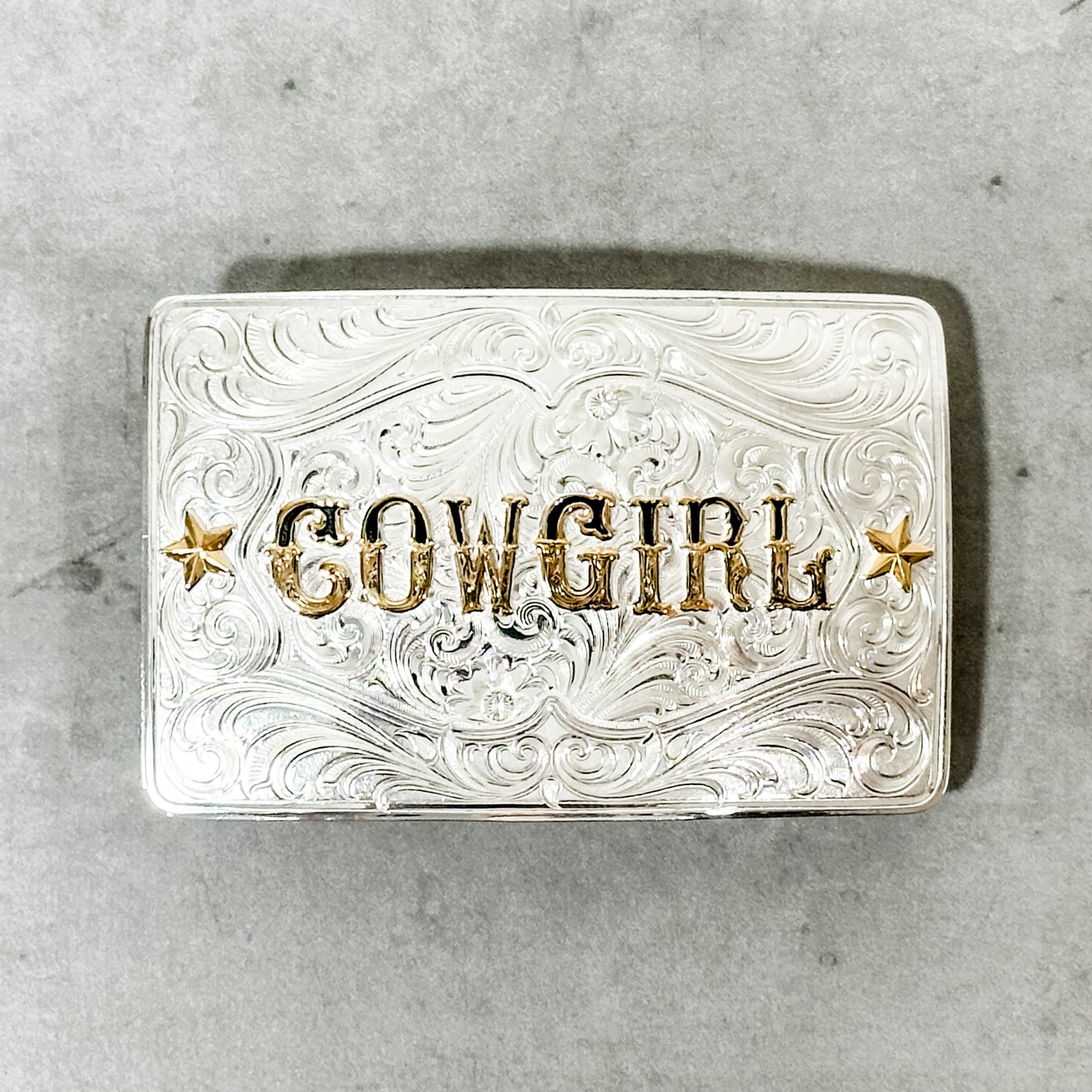 Silver Cowgirl belt buckle.