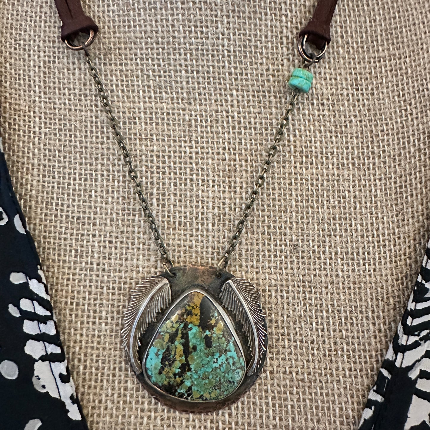Turquoise stone pendant necklace.