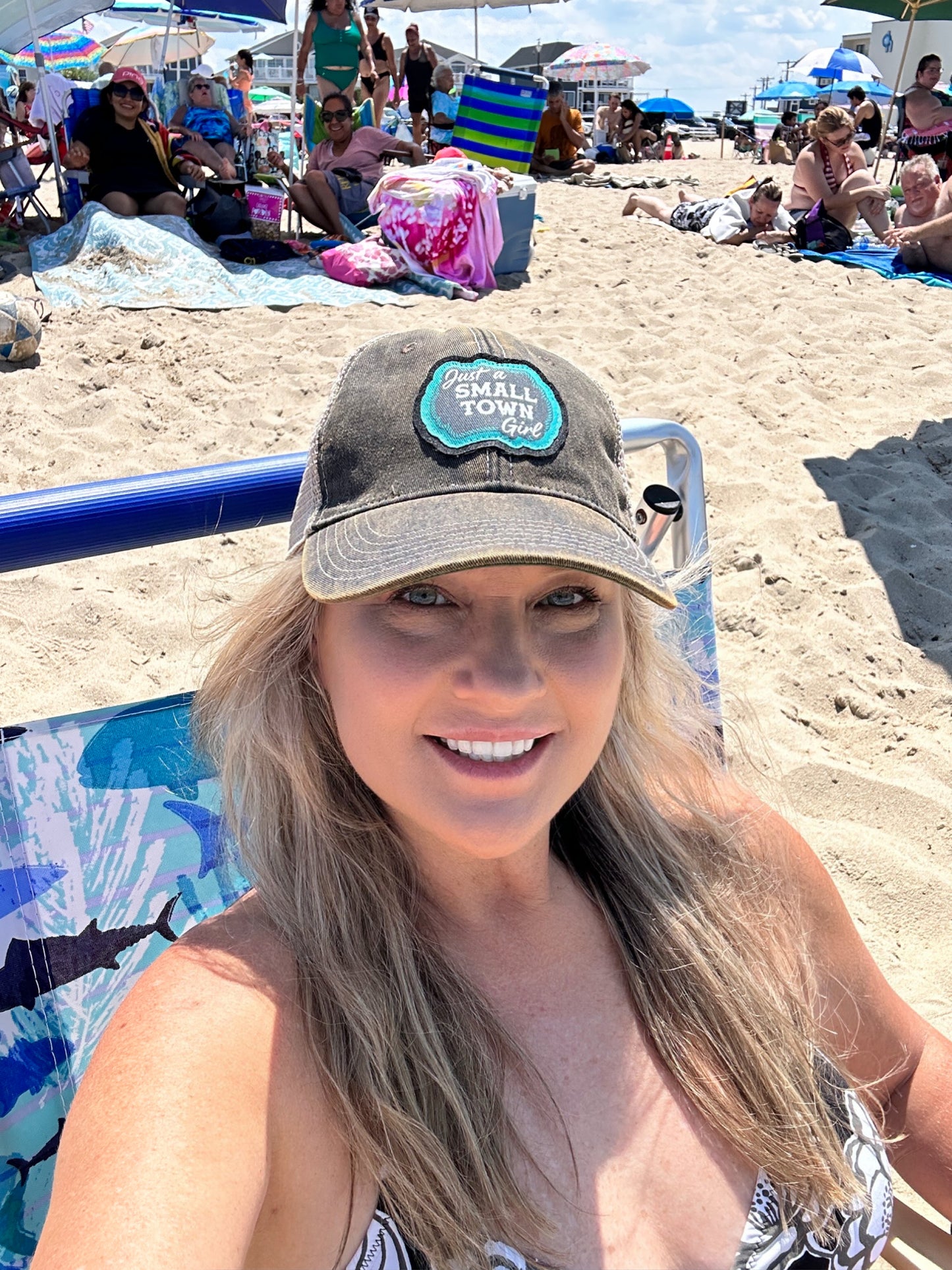 Woman wearing a hat at the beach.