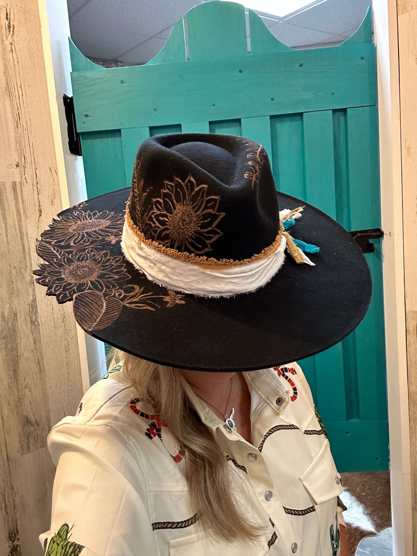 Black hat with sunflower design