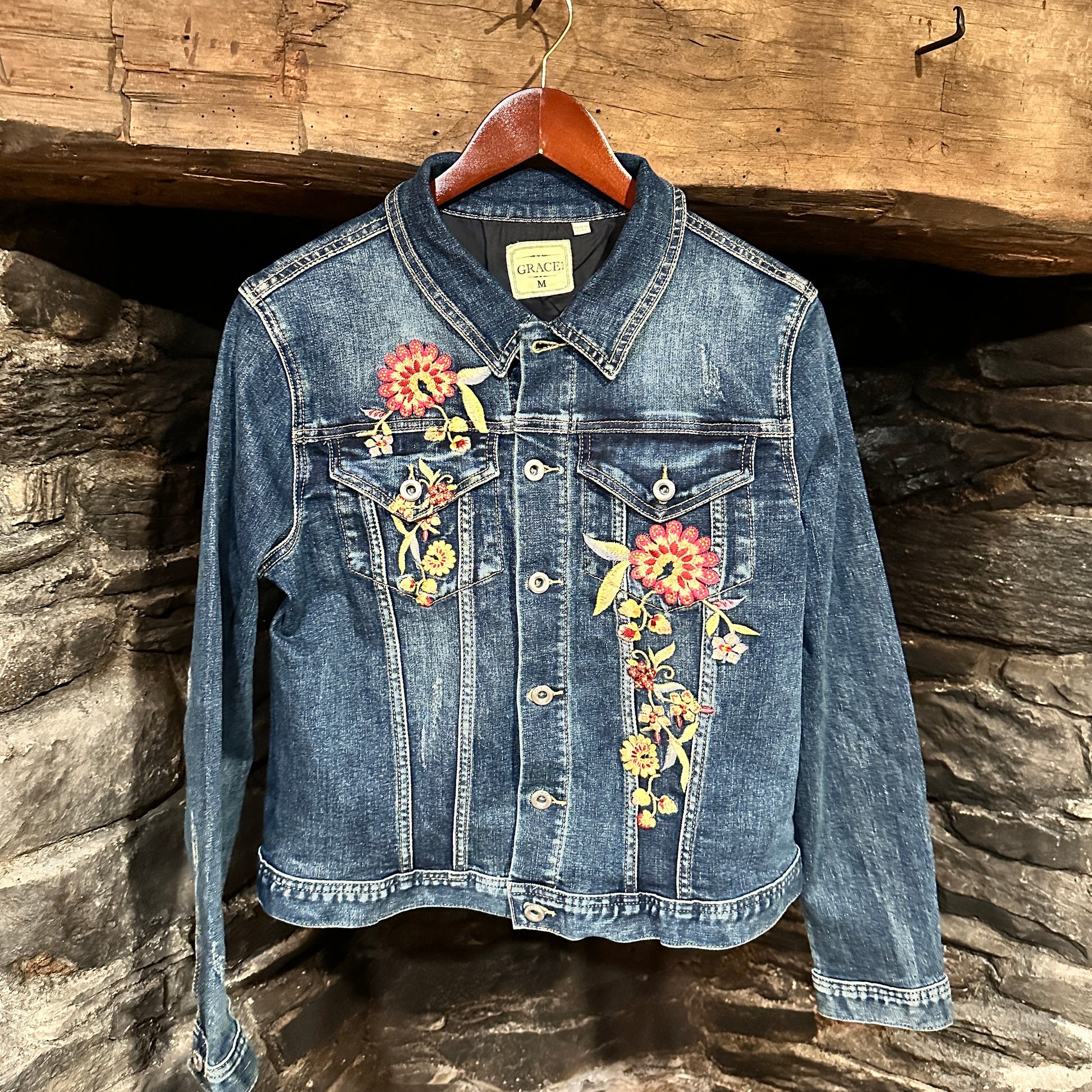 Blue denim jacket with floral embroidery