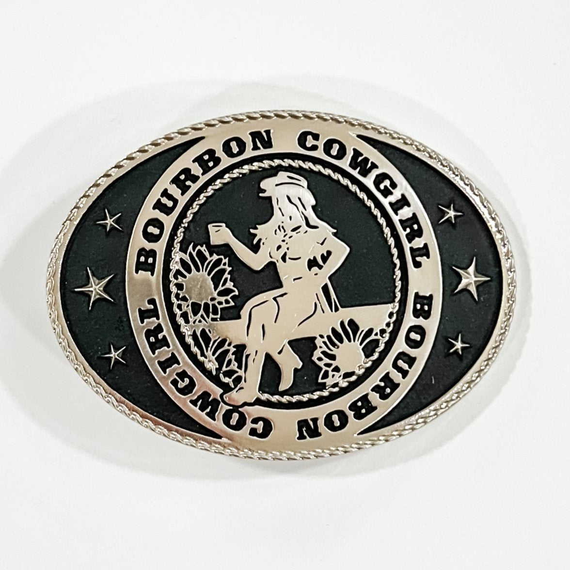 Oval belt buckle with Bourbon Cowgirl and woman silhouette.