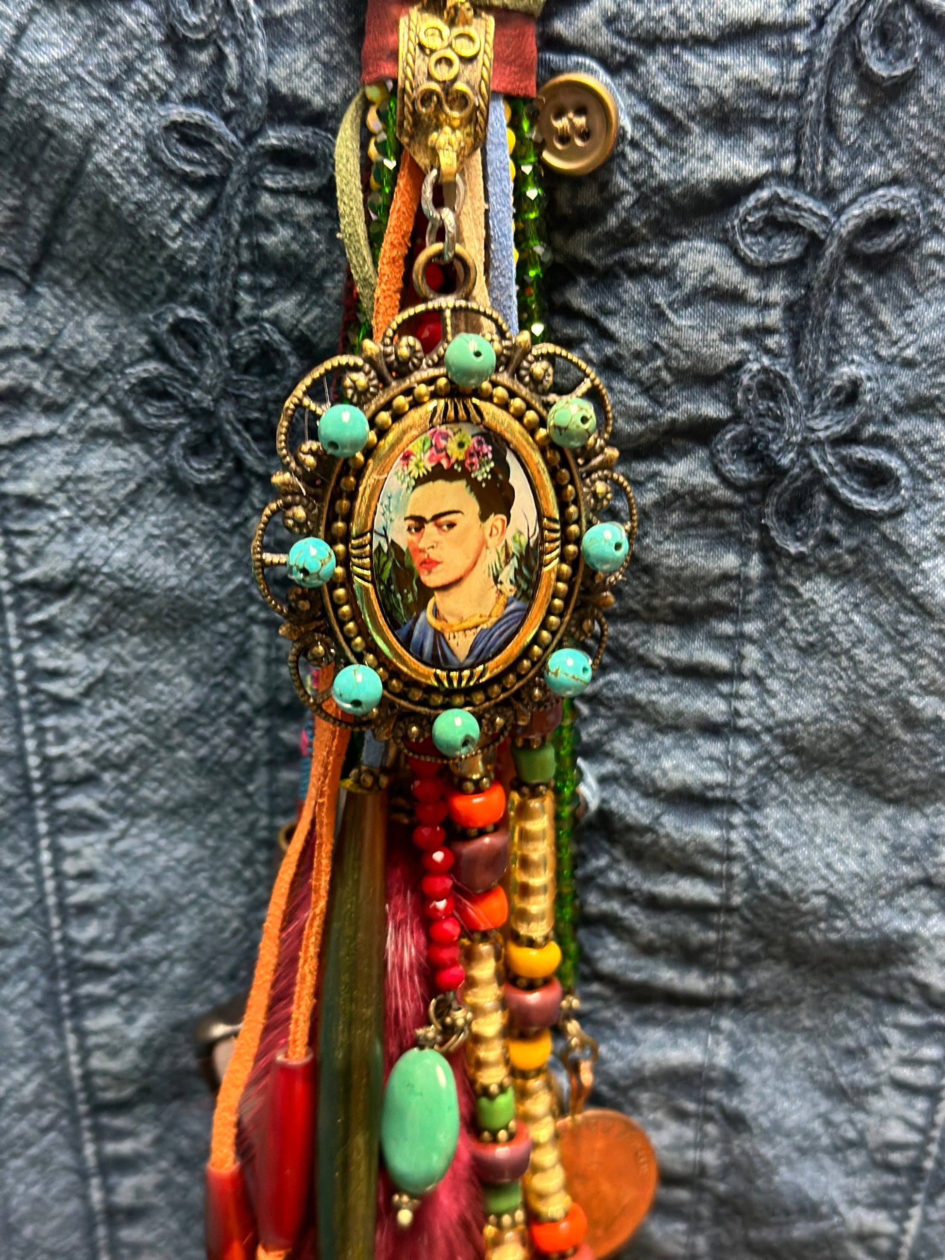 Frida Kahlo pendant with colorful beads.