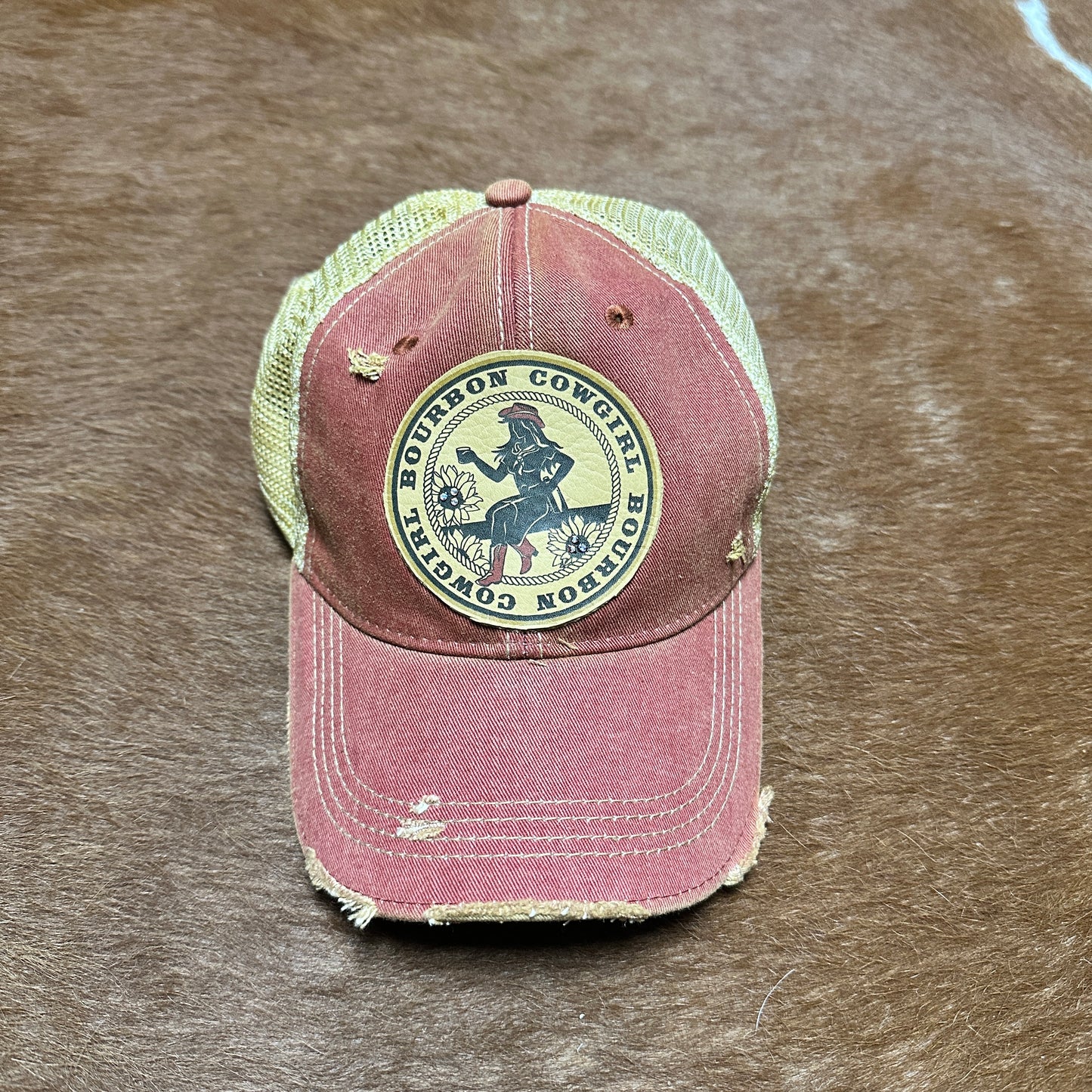 Red and tan Bourbon Cowgirl baseball cap.