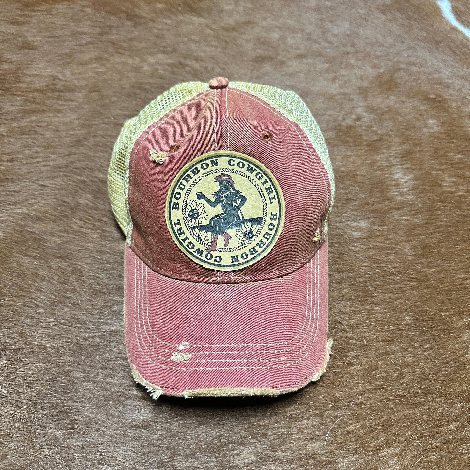 Red and tan Bourbon Cowgirl baseball cap.
