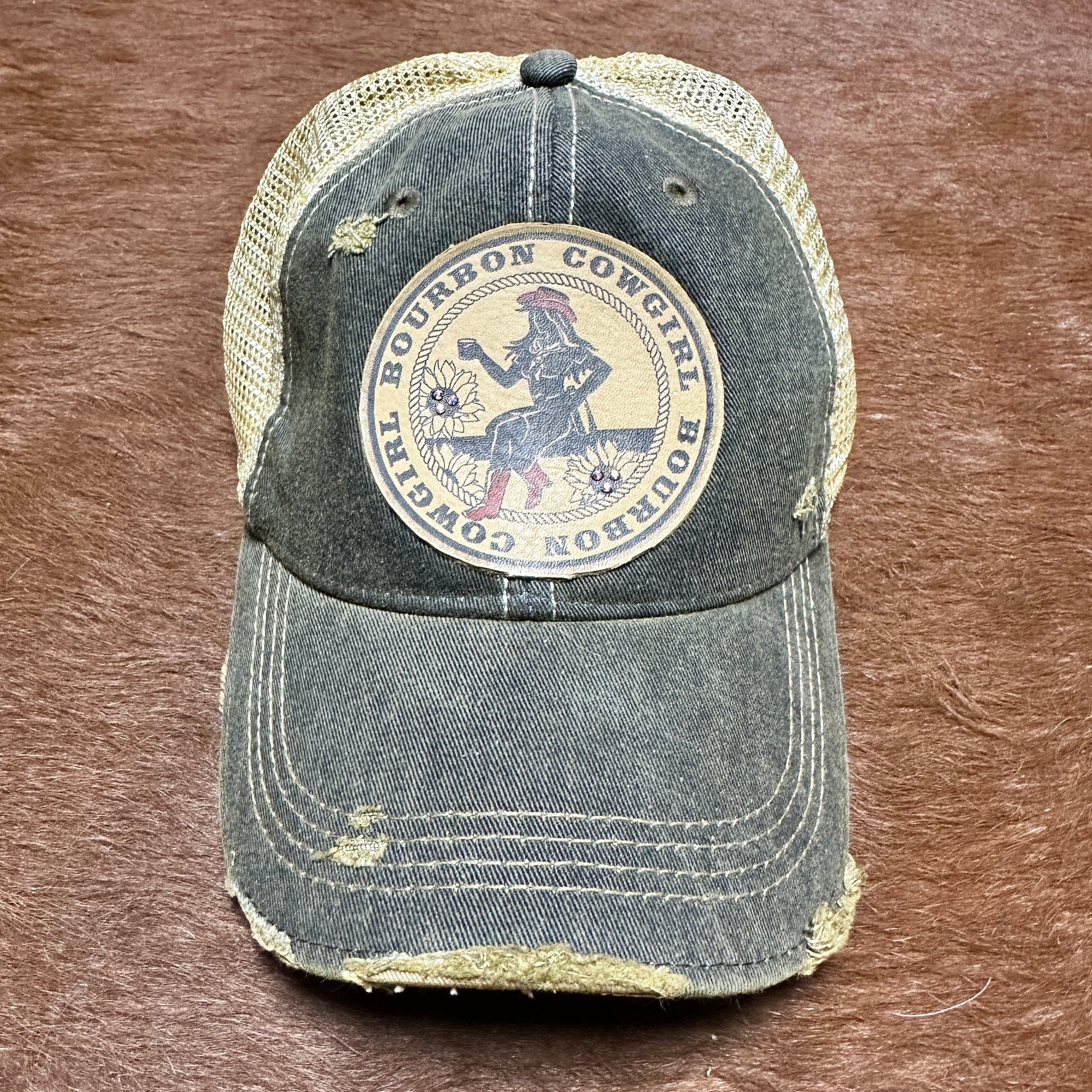 Distressed baseball cap with Bourbon Cowgirl patch.