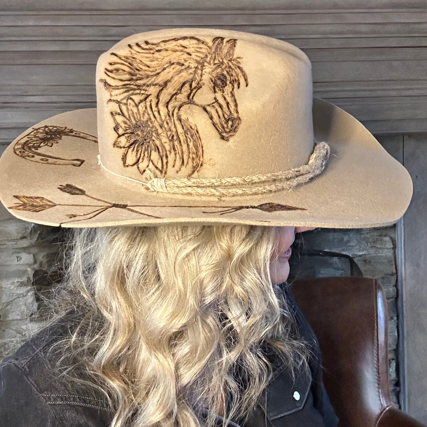 Cowboy hat with horse and floral designs.