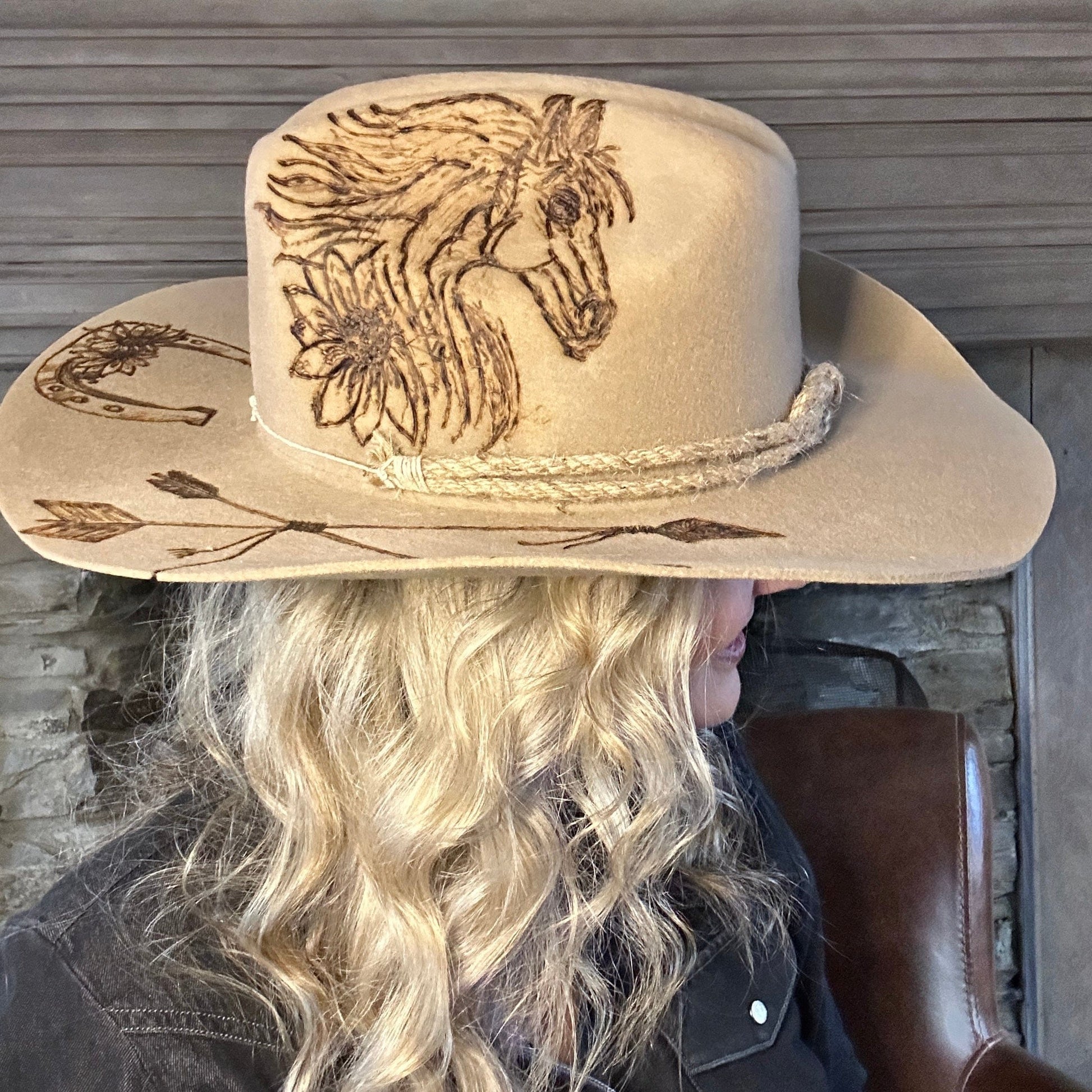 Cowboy hat with horse and floral designs.
